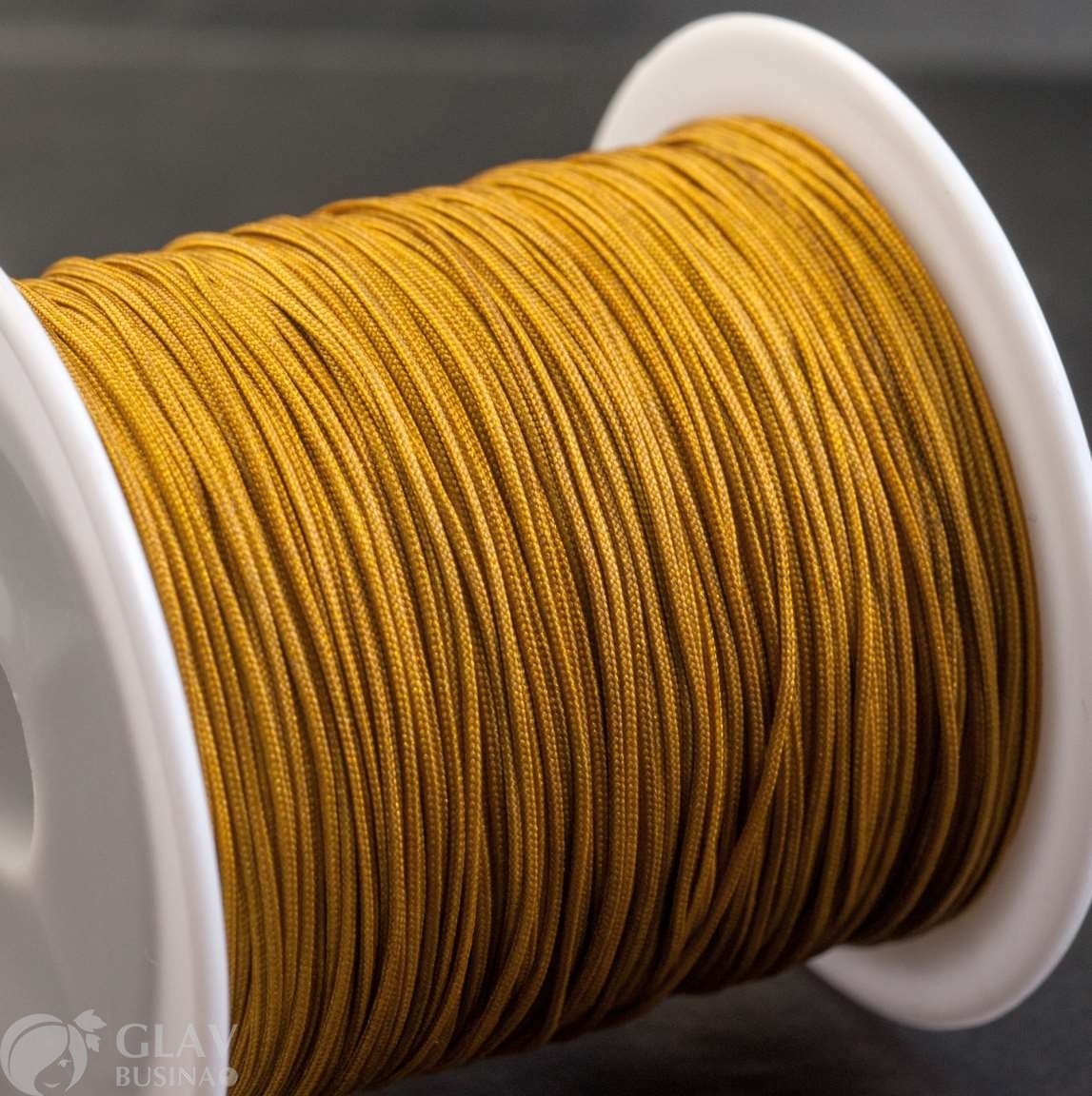 Нейлоновый шнур на катушке, цвет светлая бронза, 0.6мм, длина ок.40м.