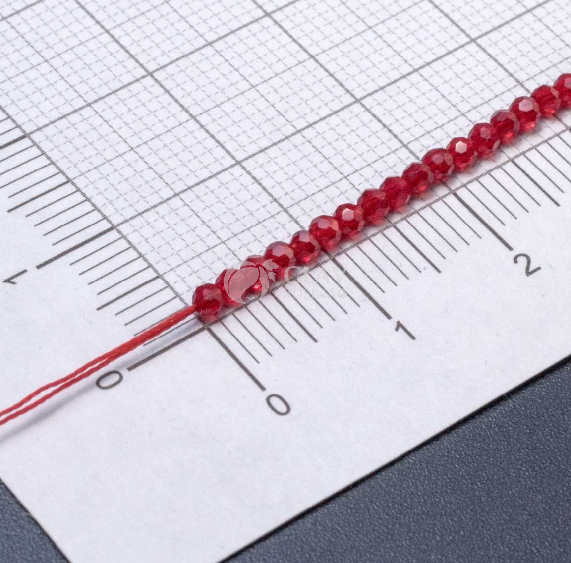 Нитка прозрачных хрустальных бусин на красной нити, цвет рубин (яркий красный), р-р 2х2мм, отв.0.8мм, ок 36 см / 180 бусин.