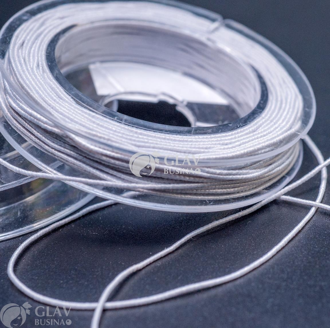 ОПТ (10 кат.) Белая шляпная резинка (для браслетов) на катушке, диам. 0.5мм, длина 10 м.