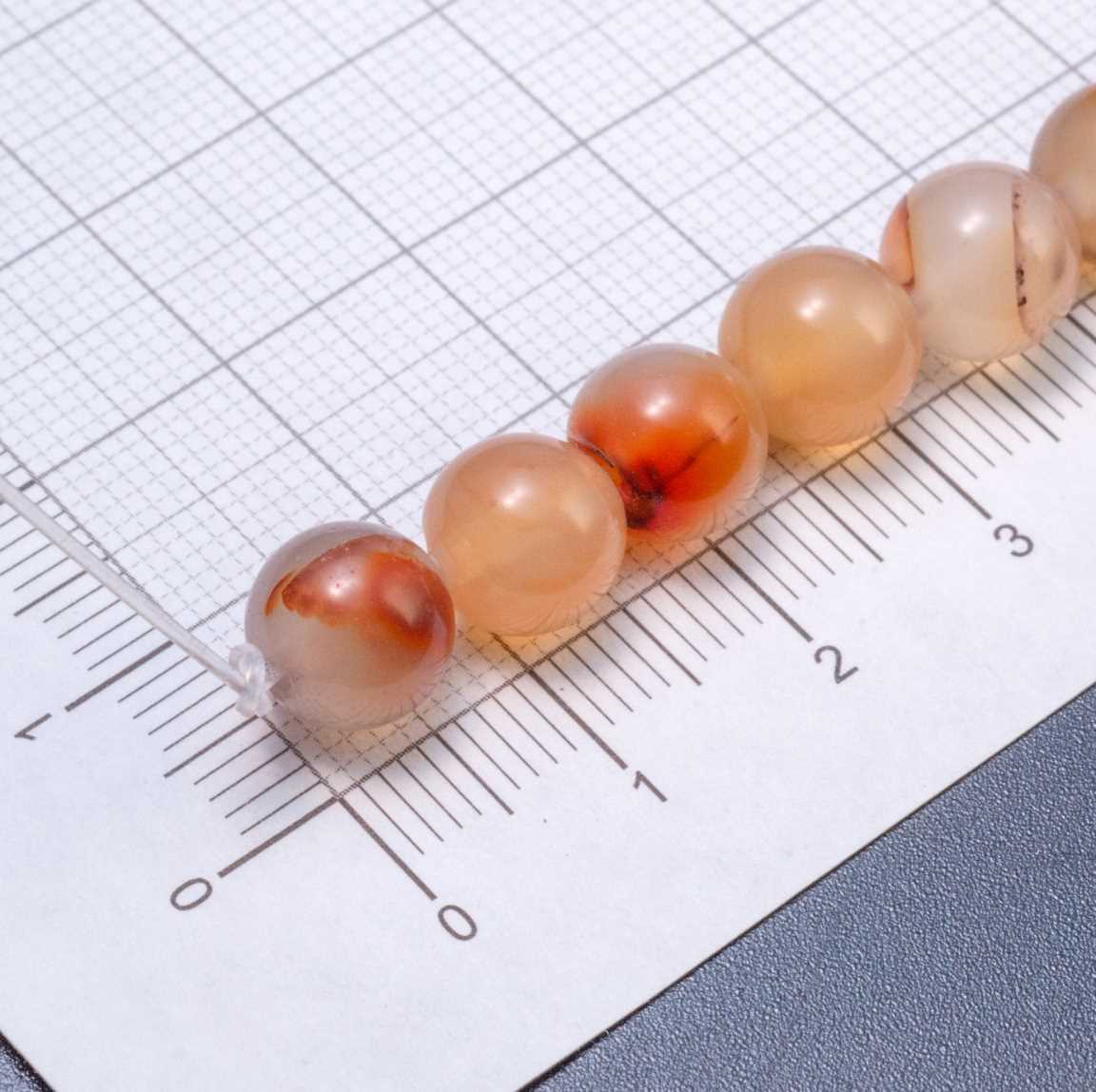 Нитка гладких полупрозрачных бусин агата, шар, 8мм, отв 1,6м, цвет тонирования Эбру светло-оранжевое, в нитке 23 бусины / 18см.