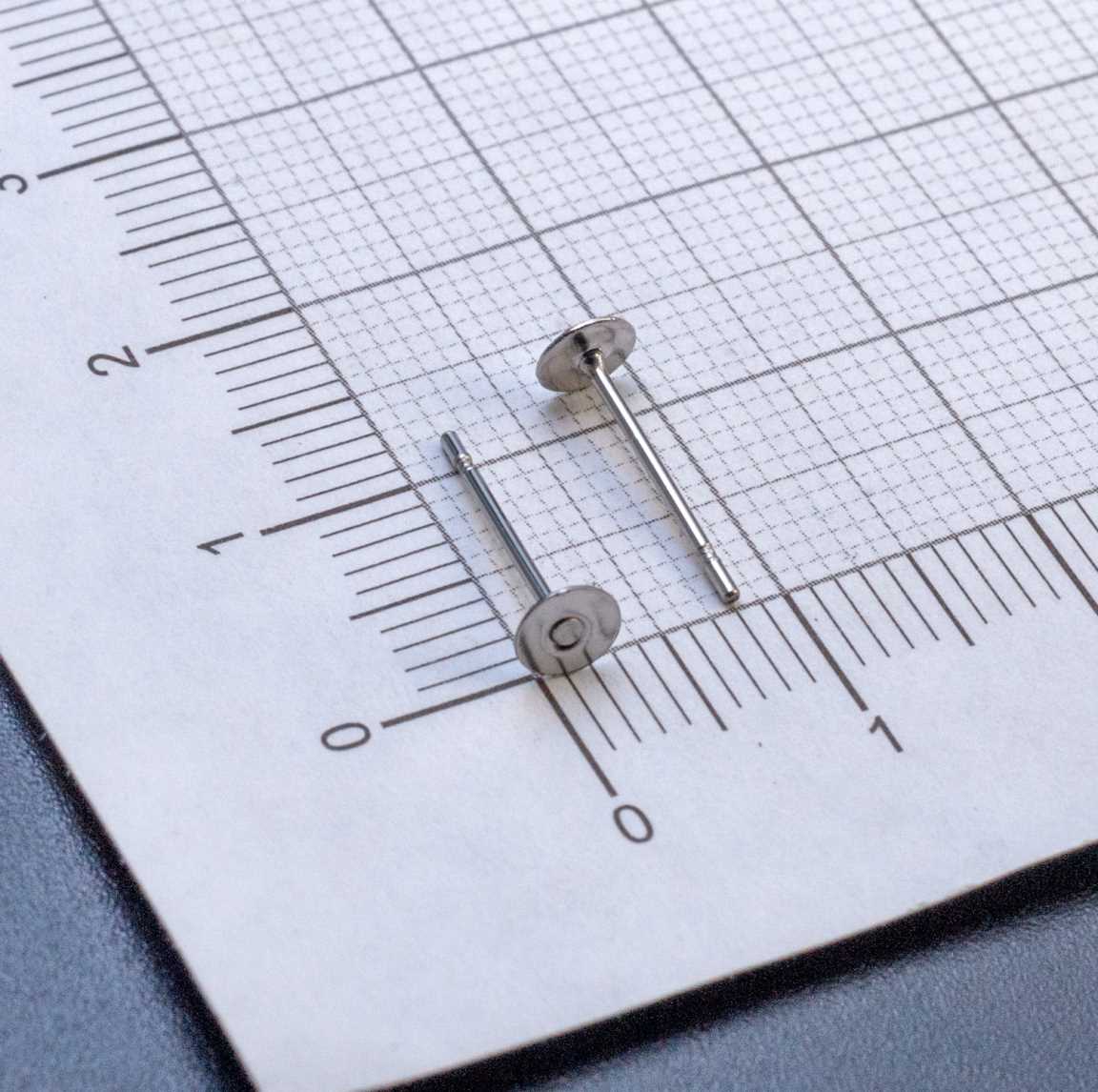 ОПТ (100 пар) Пуссеты из хирургической стали с плоской площадкой 4мм и закругленным гвоздиком 12х0.7мм.