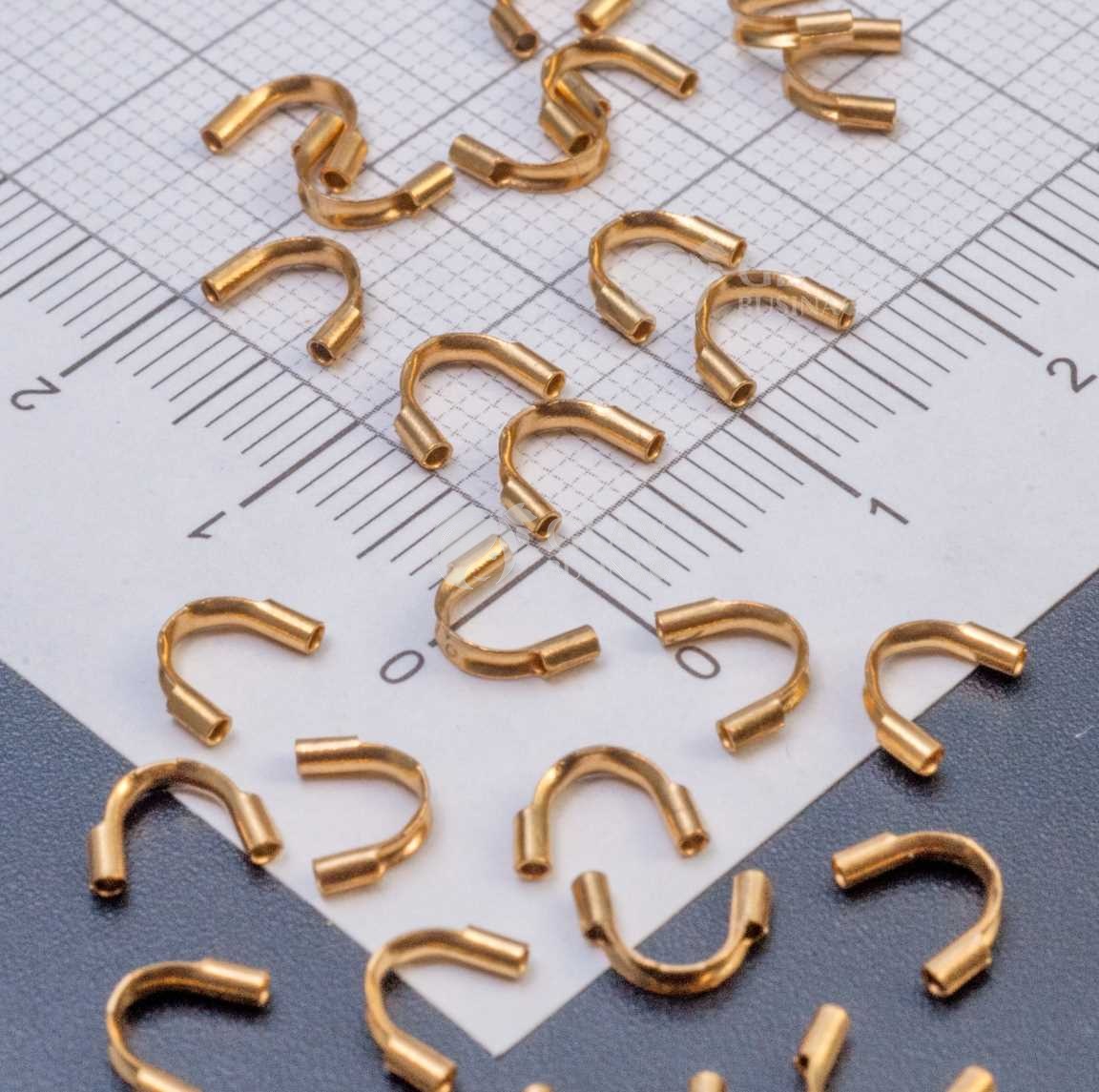 Протектор для ювелирного тросика, 7х4.5х1.4 мм, хирургическая сталь, отв-е 0.9 мм, долговечное золотое покрытие.