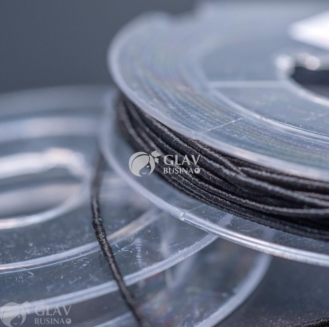 ОПТ (10 кат.) Черная шляпная резинка (для браслетов) на катушке, диам. 0.5мм, длина 10 м.