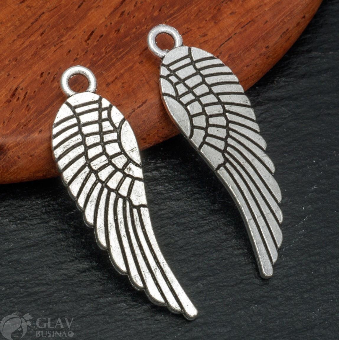 Подвеска двусторонняя из бижутерного сплава, крыло пегаса, 30х10х1мм, отв. 1,7мм, античное серебро.