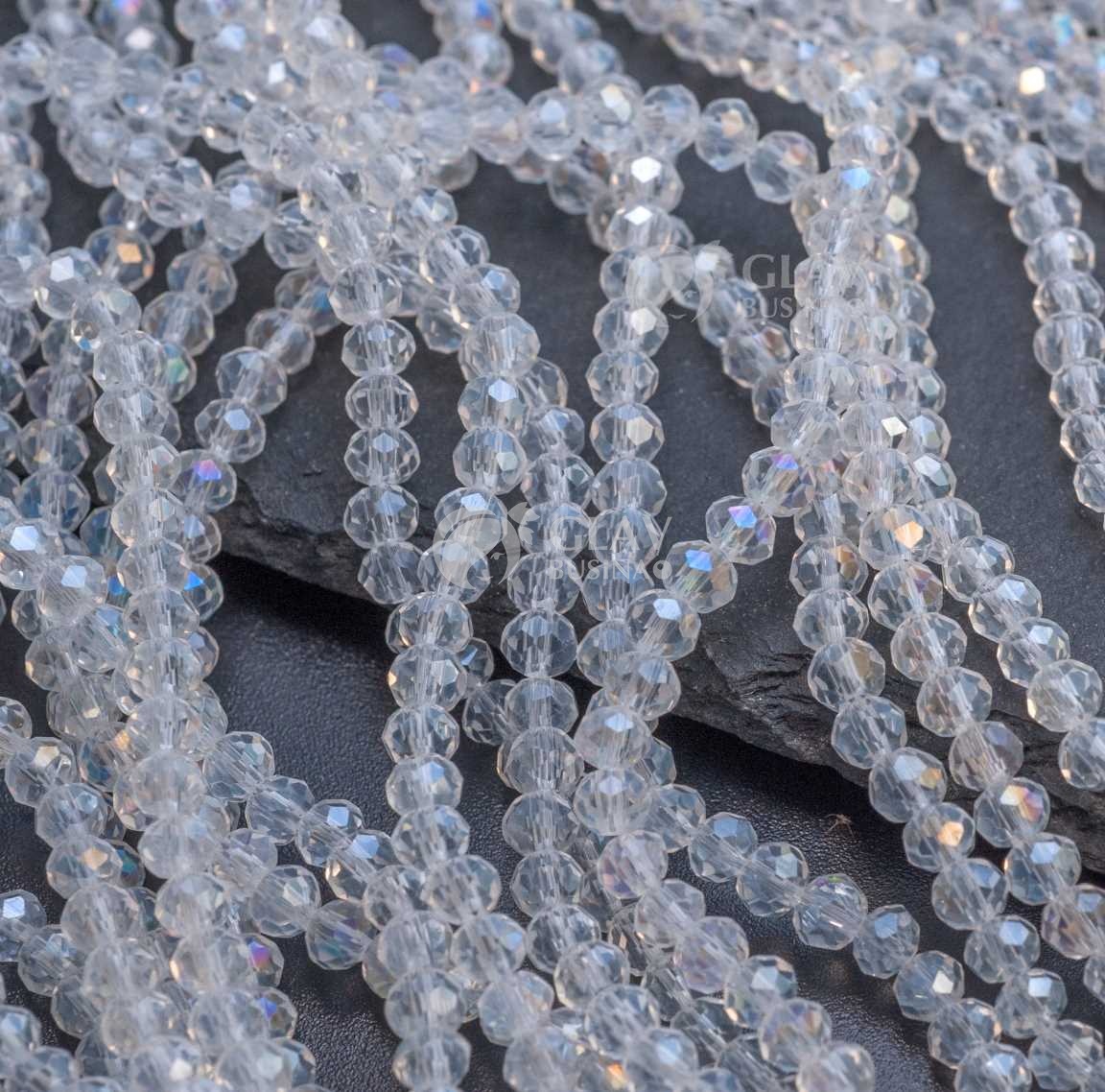 Бусины-рондели граненые стеклянные прозрачные, р-р 3х3.7 мм, нитка 32,5 см/110 бус., бесцветные, АВ покрытие.