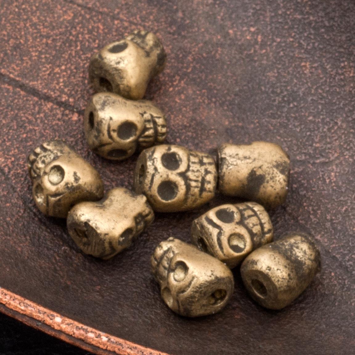 Бронзовые бусины-черепа, р-р 7х5-6,5мм, отв. 1,5мм.