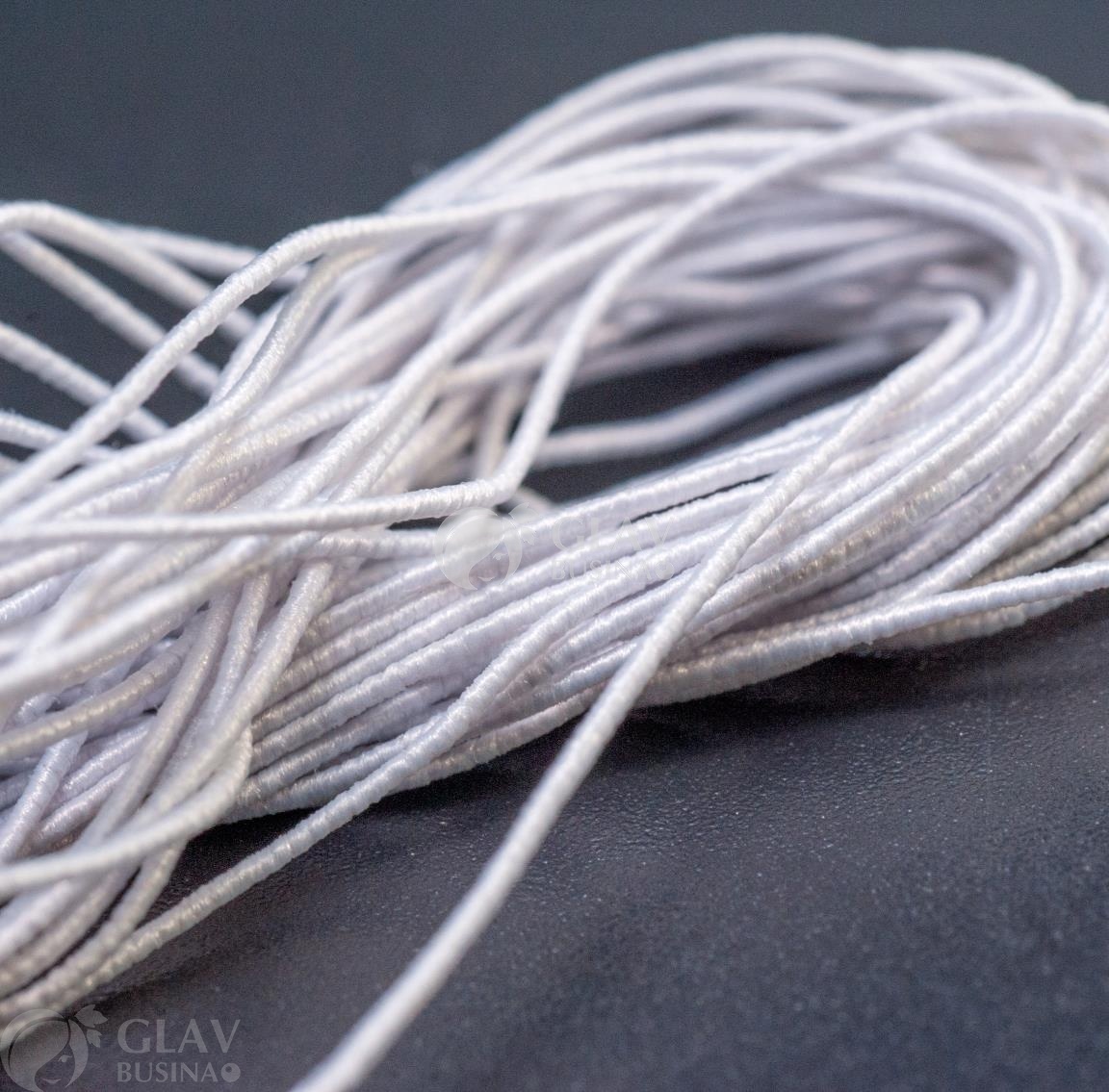 ОПТ (10 кат.) Белая шляпная резинка (для браслетов) на катушке, диам. 0.5мм, длина 10 м.
