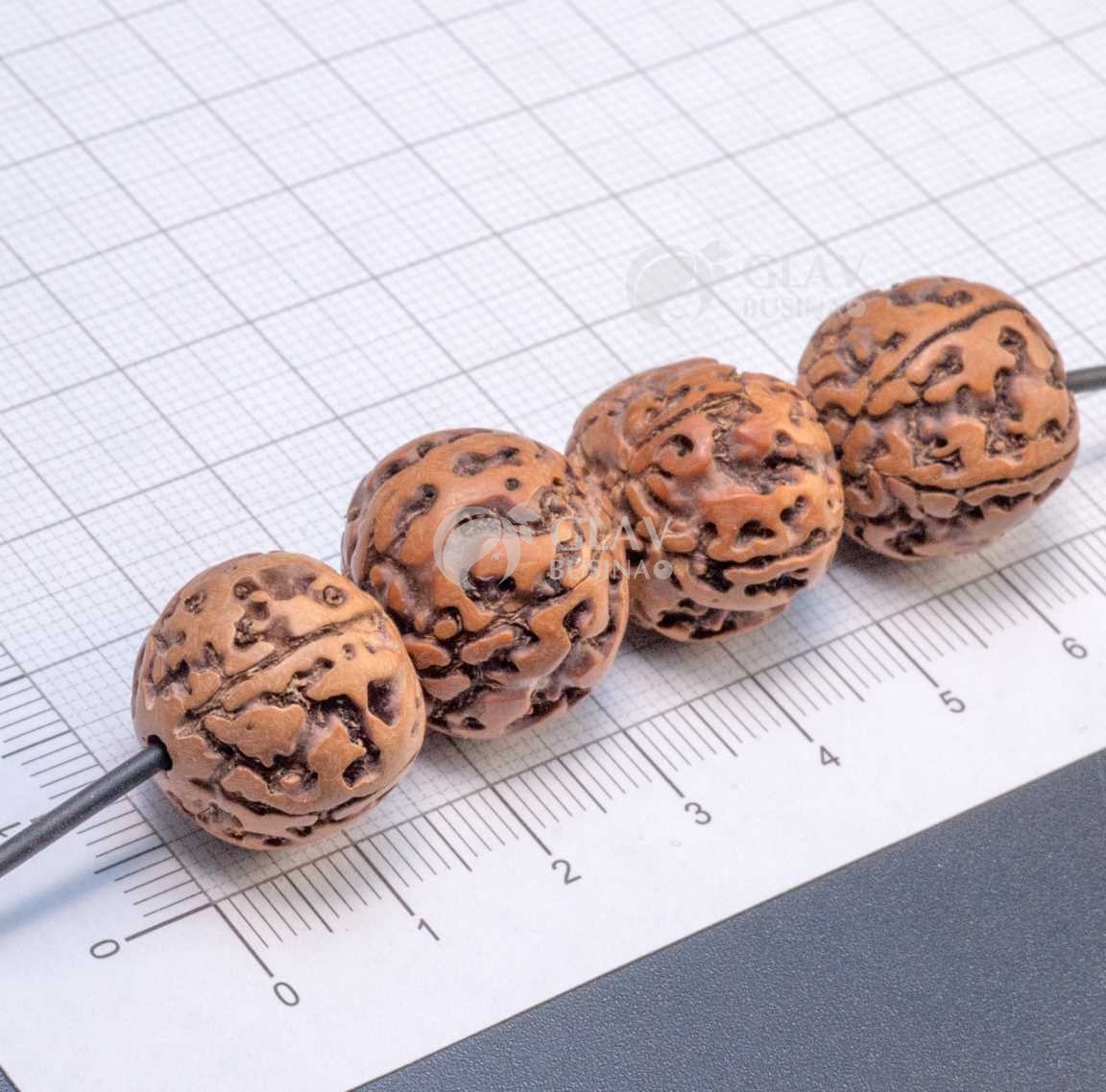 Бусины рудракша, не ровные, диам. 17-20мм, отв. 1.8 мм, цвет светло-коричневый, без покрытия.