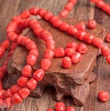 Бусина-пуля из непрозрачного стекла, граненая, цвет апельсиновой карамели (оранжевый с белёсыми участками), р-р 7х6мм, отв. 1мм.