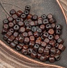 Бусины-кубики из дерева, не шлифованные, покрыты лаком красно-коричневого цвета, глянцевые, р-р 4,5х4,5мм, отв. 1мм - упаковка ок. 110 бусин (низка 50 см).